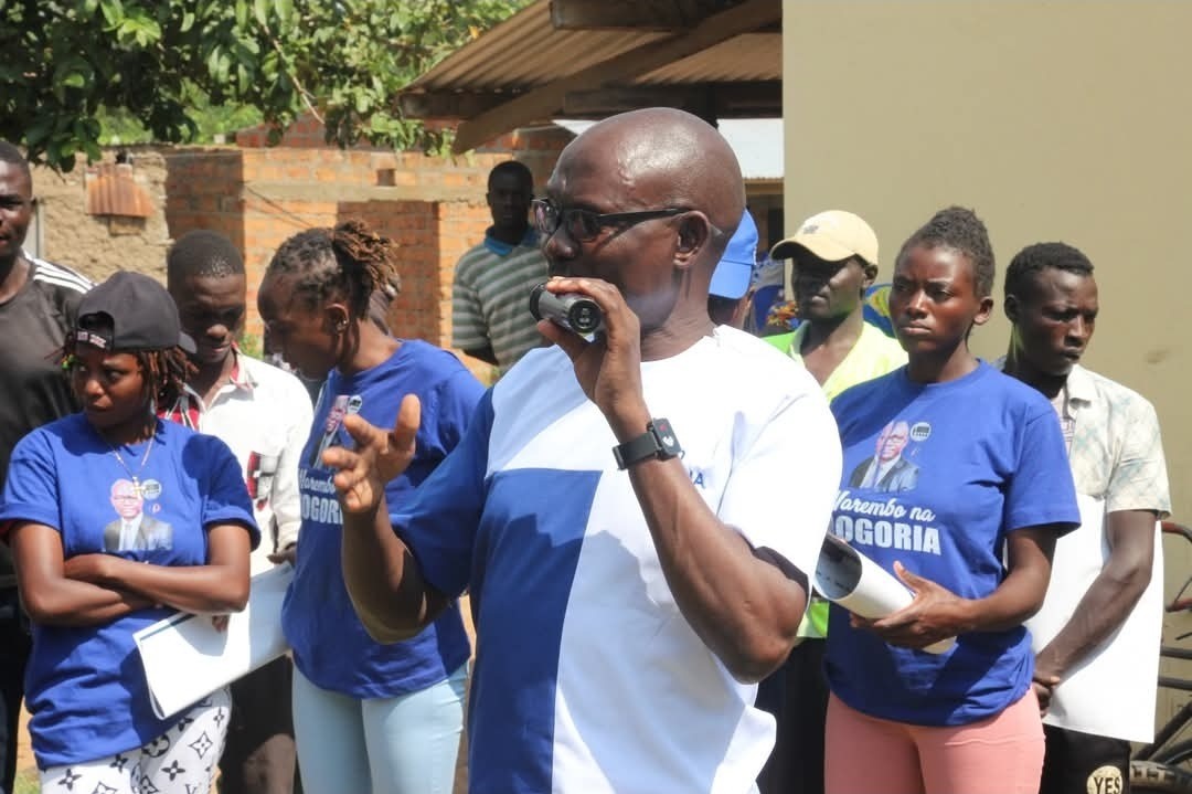Dan Mogoria speaking with a microphone in Adanya