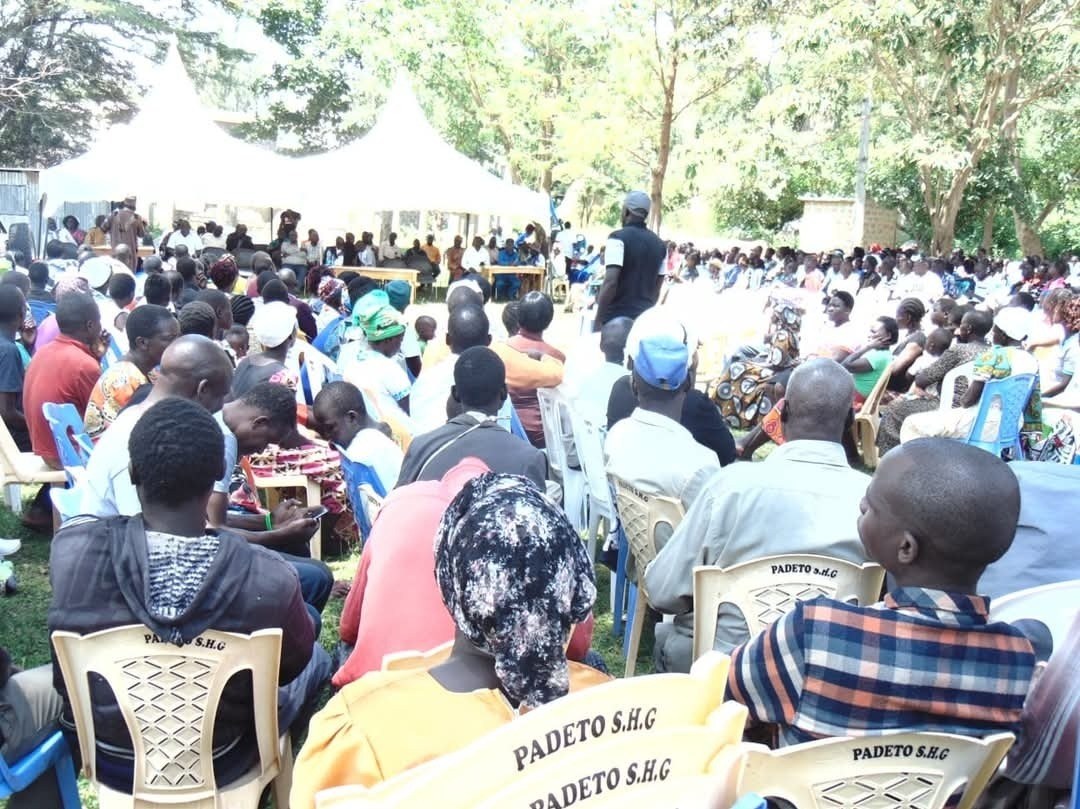 A community meeting under tents