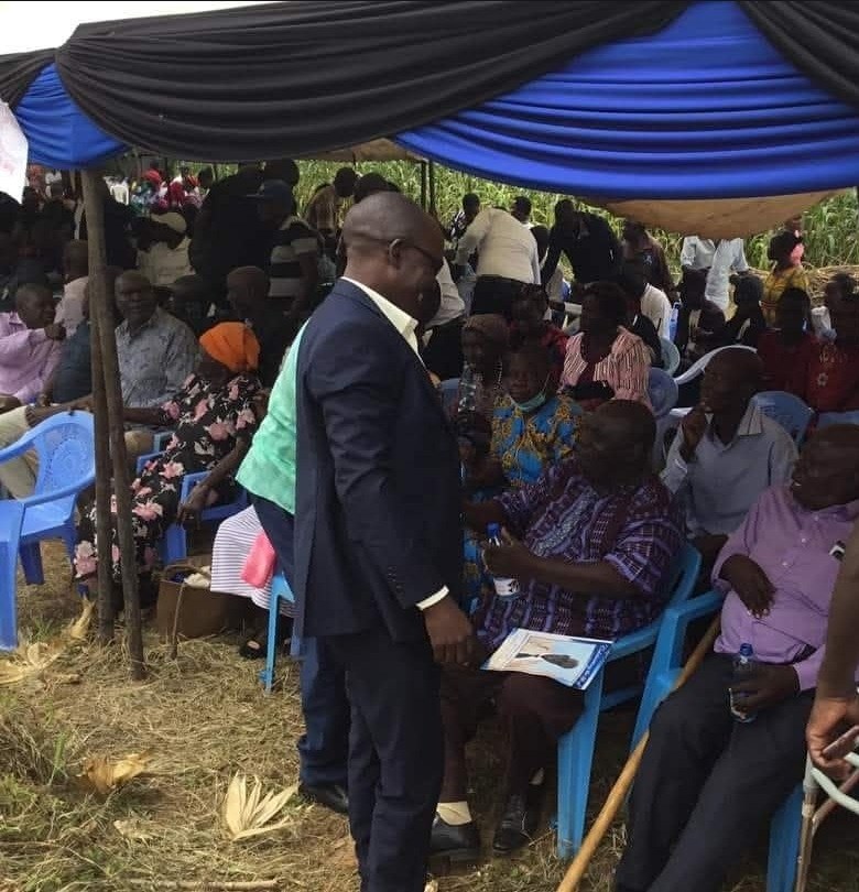 Dan Mogoria greeting elders under a tent