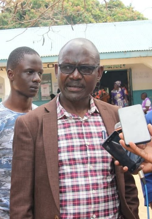 Dan Mogoria speaking to the press